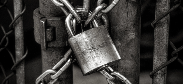 Lock with chains on a metal gate