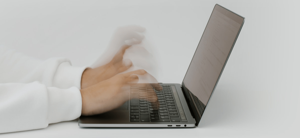 Man typing on laptop