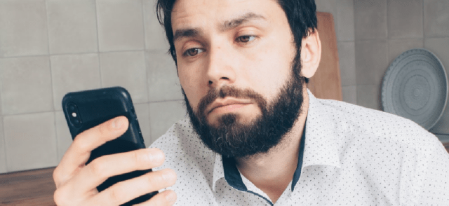 A man looking at his phone