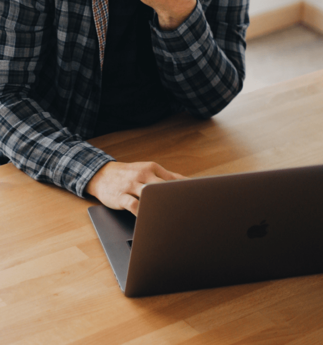 Person typing on a laptop