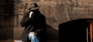 Man with a hat talking on the phone