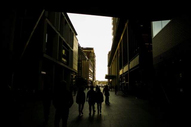Dark urban alleyway , symbolizing hidden threats and unseen digital activity.