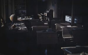 Dark office environment showing interconnected multi-agent AI systems network visualization
