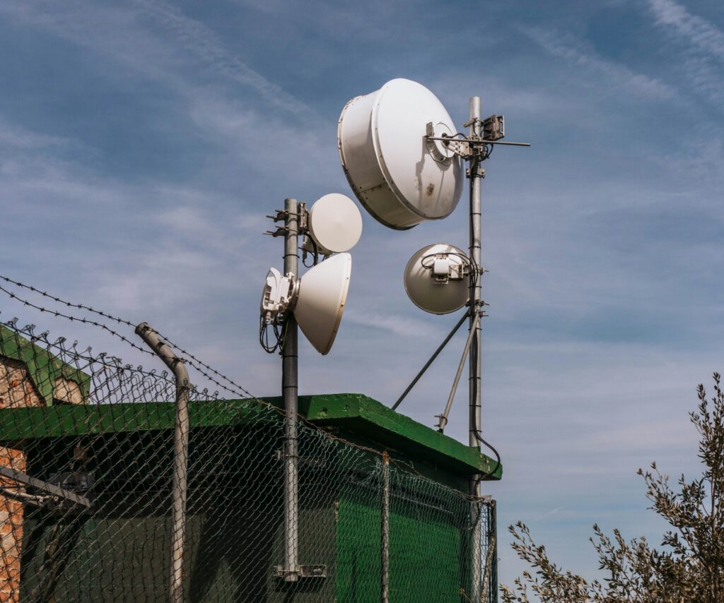 telecomms antenna near a fence