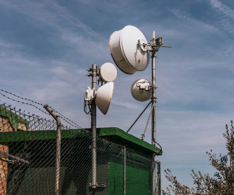 telecomms antenna near a fence