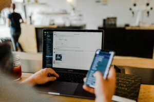 A Slack conversation in sharp focus against a faded background, evoking a software supply chain security failure: one exposed token overlooked for over a year.