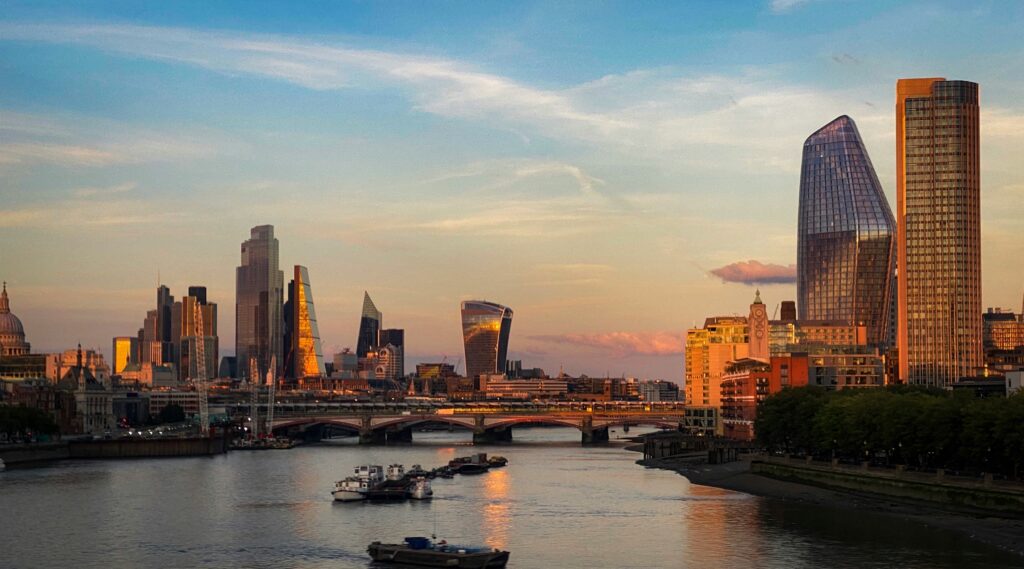 The City of London skyline at dusk, evoking the scale of digital infrastructure an insurance giant trusted to stay secure.