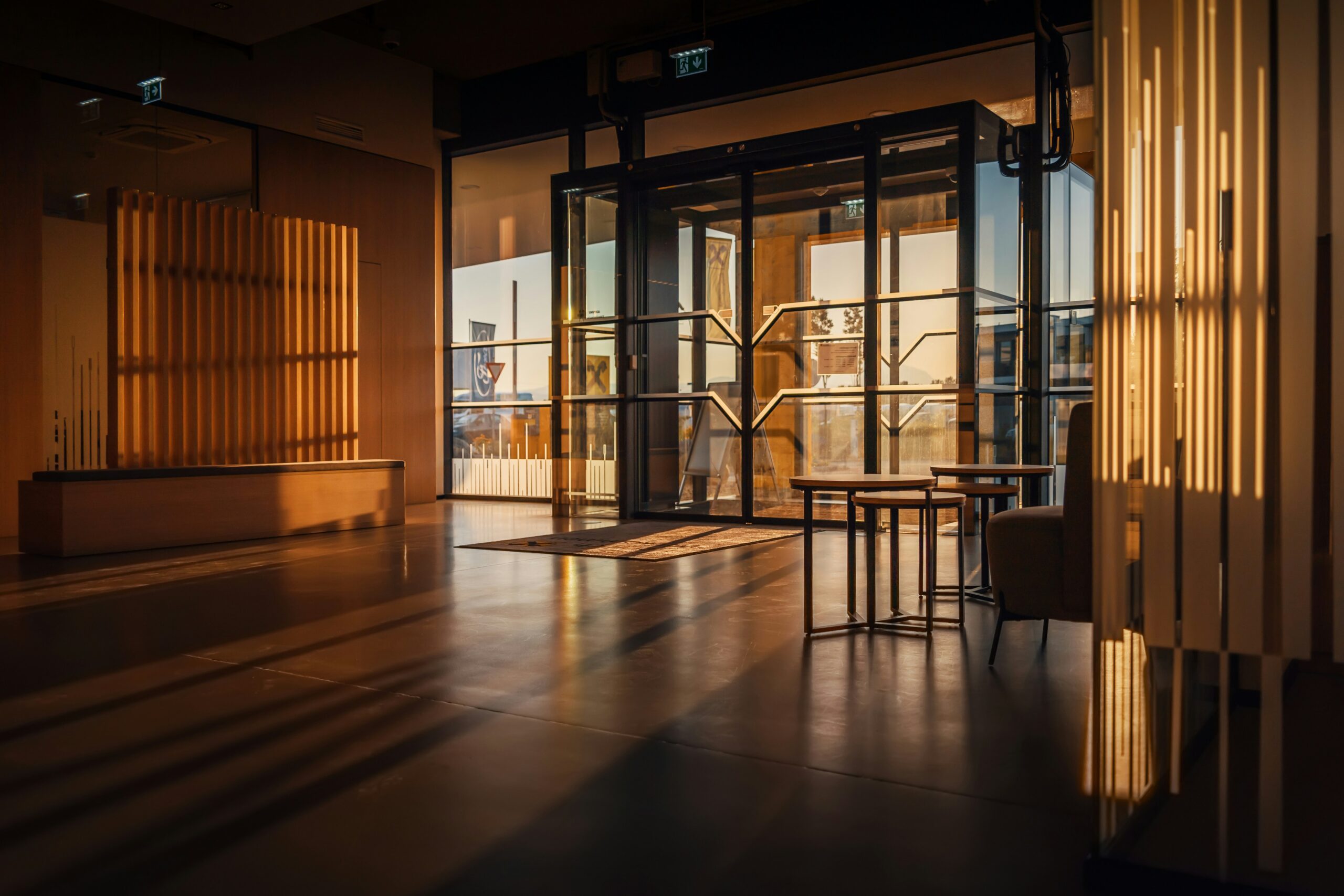 An empty office reception desk seen through glass, evoking the unattended front door a spear phishing attack walked straight through.