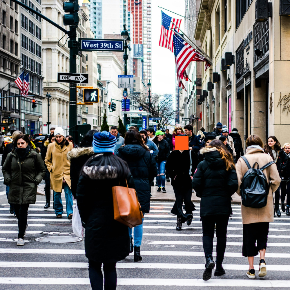 A crowd of people in a New York street