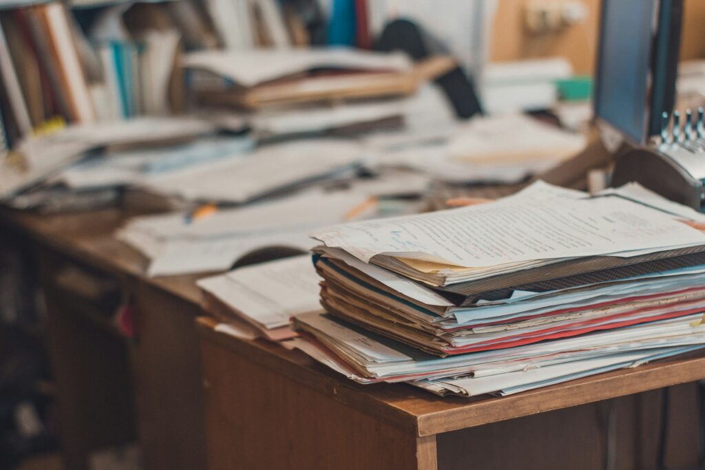 Desk with loads of papers